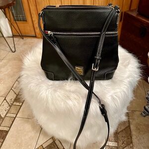 Dooney and Burke crossbody. Black. Used once. Like new